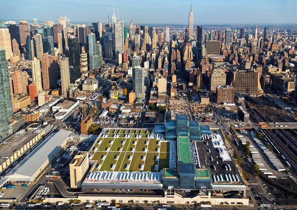 A green roof with trees, bushes, shrubs, and sustainable amenity hardscape on a commercial building.