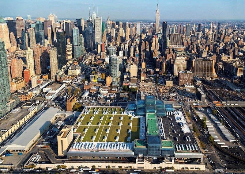A green roof with trees, bushes, shrubs, and sustainable amenity hardscape on a commercial building.