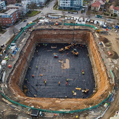 Construction site for new building using pre-applied waterproofing membrane material from Siplast.