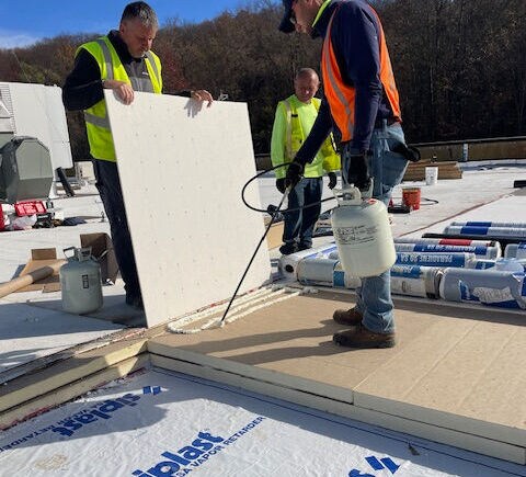 A commercial roof with solar panels.