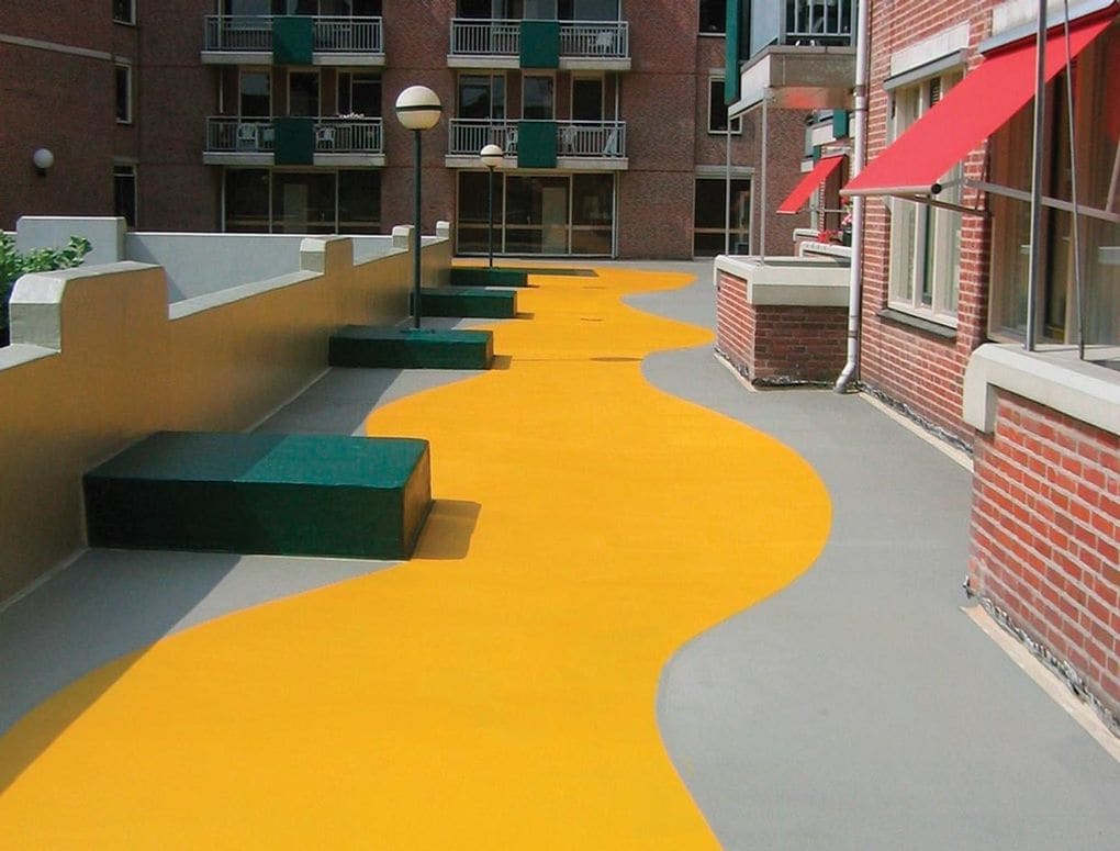 PMMA applied to a roof's surface with pedestrian access.