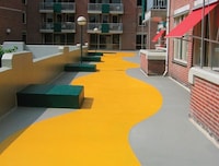 PMMA applied to a roof's surface with pedestrian access.