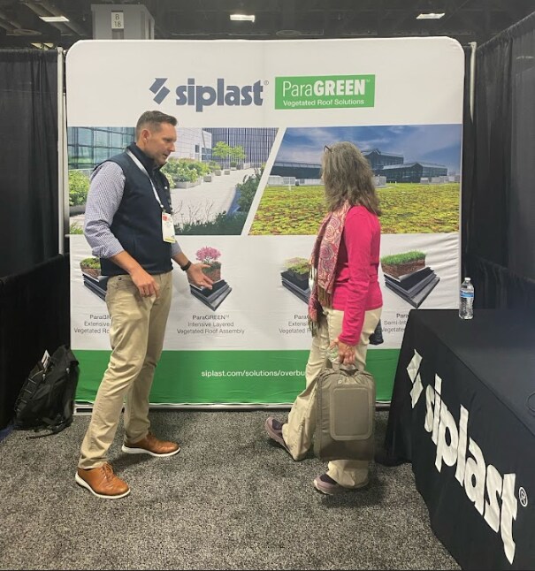 rick kile talking to a conference attendee about siplast paragreen Rick Kile talking to a conference attendee about Siplast ParaGREEN
