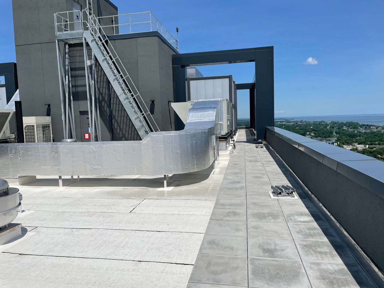 Parapets are a critical interface where building aesthetics meet performance.